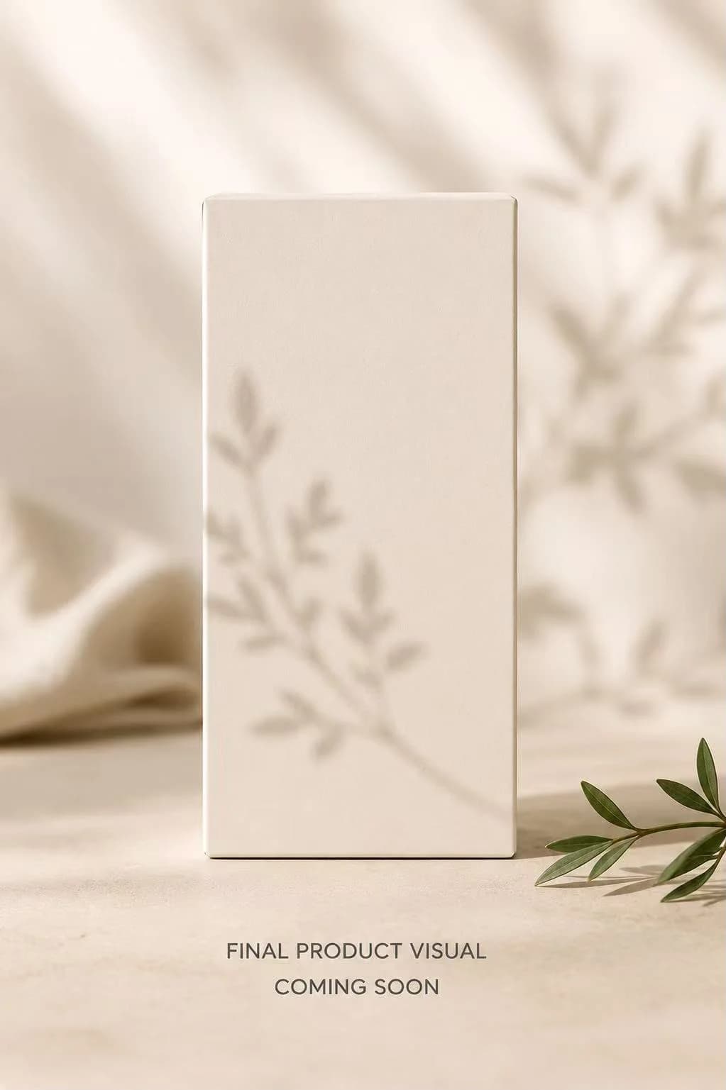 An unbranded cream carton beside an olive sprig, captioned: final product visual coming soon